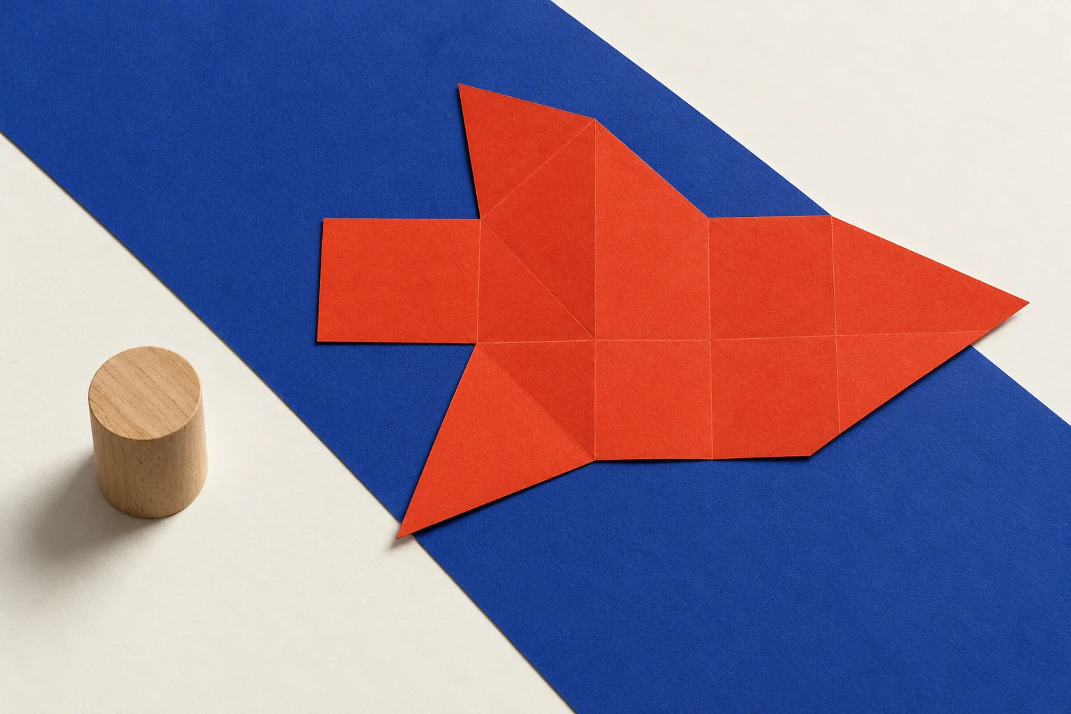 Illustrative composition A: flat blue and red paper planes beside a wooden cylinder