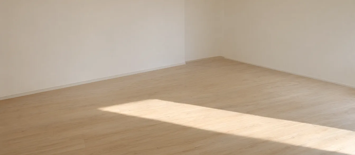 A newly installed wood floor in an open living room.