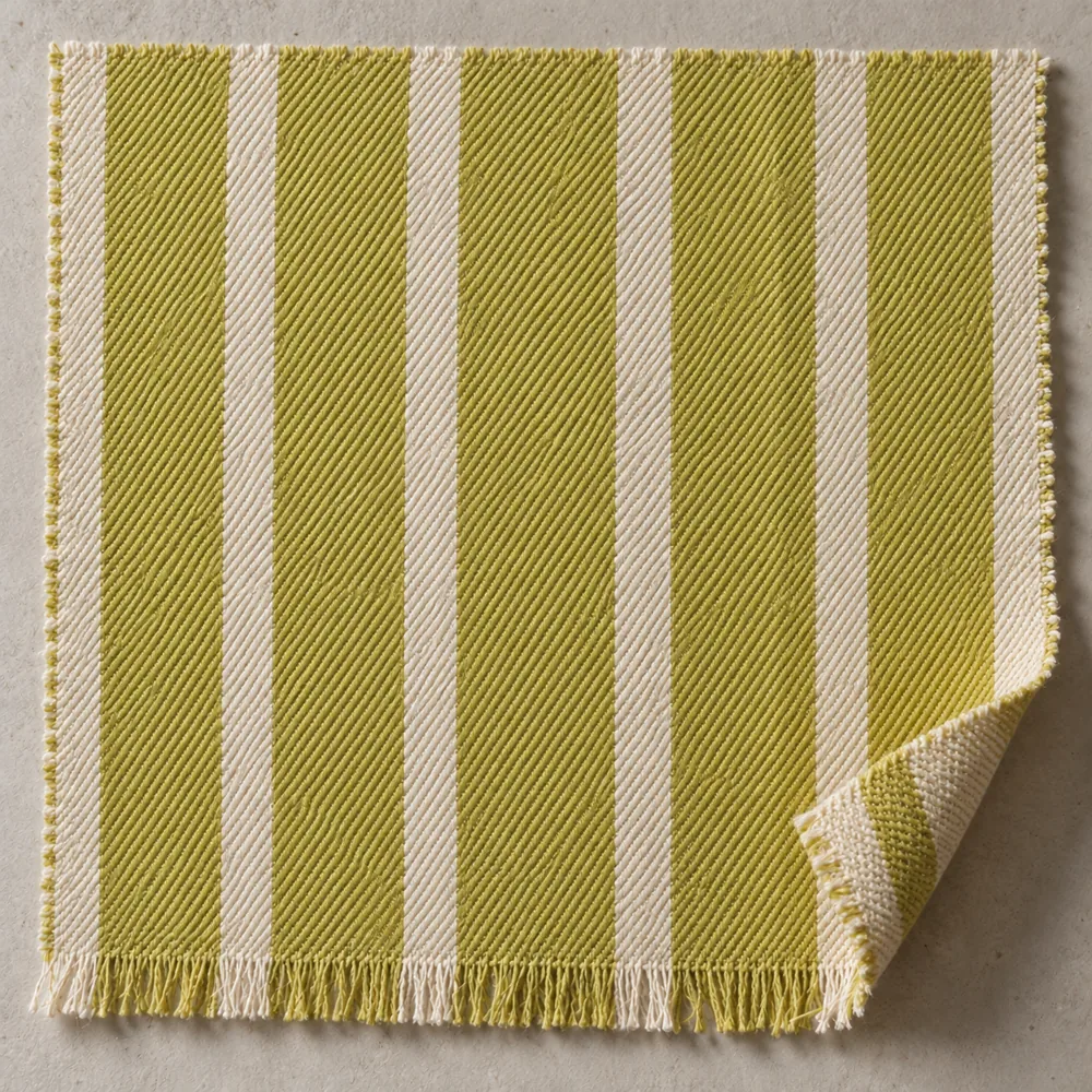 Acid and ivory striped cotton with fine diagonal twill ribs and a short fringe.